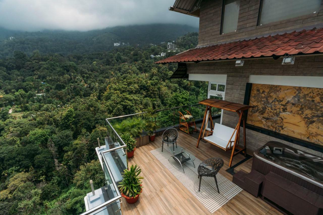 The Panoramic Getaway Otel Munnar Dış mekan fotoğraf A view from the balcony of a house in Kerala, India